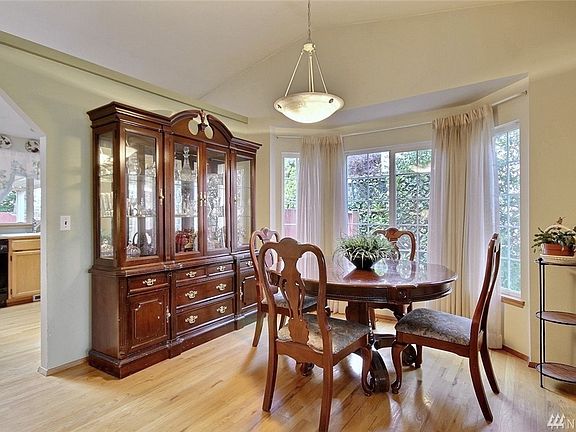Dining room also has a full height bay window providing table space and plentiful natural light.