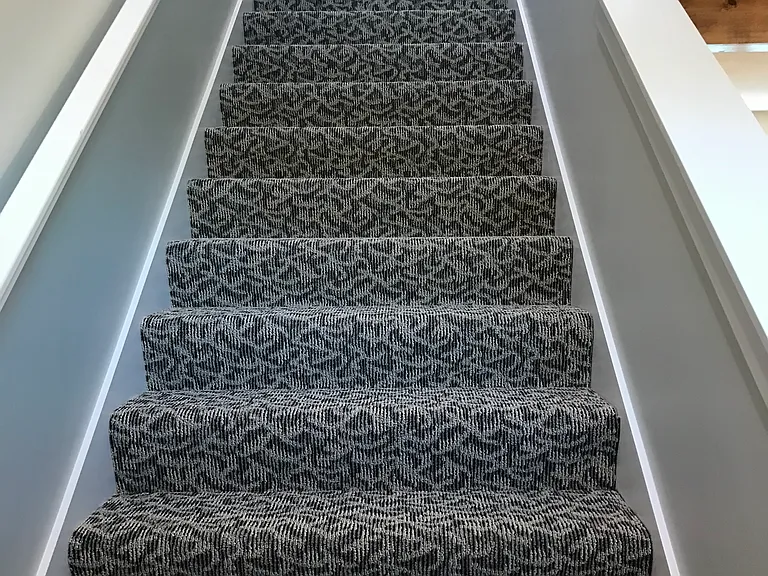 2nd floor stairs. Only carpet in place is the 2 staircases