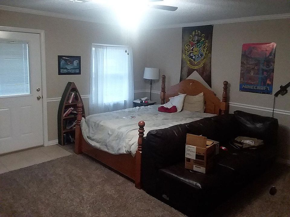UPSTAIRS BEDROOM. PICTURED DOOR LEADS TO BALCONY OVERLOOKING BACKYARD.