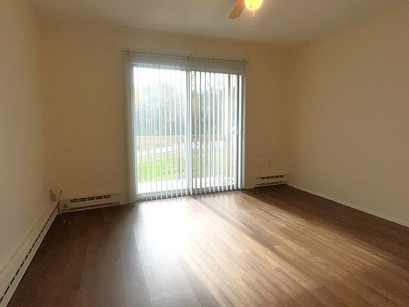 Living room with sliding door to private balcony.