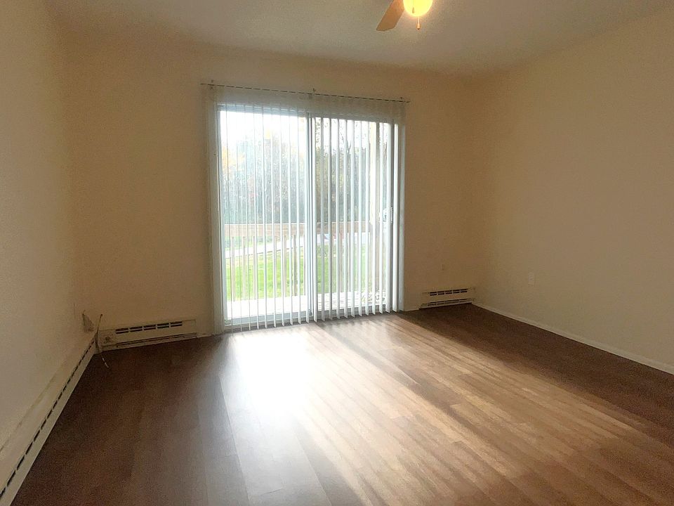 Living room with sliding door to private balcony.