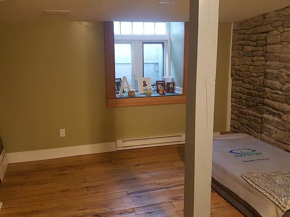 living room with stone wall