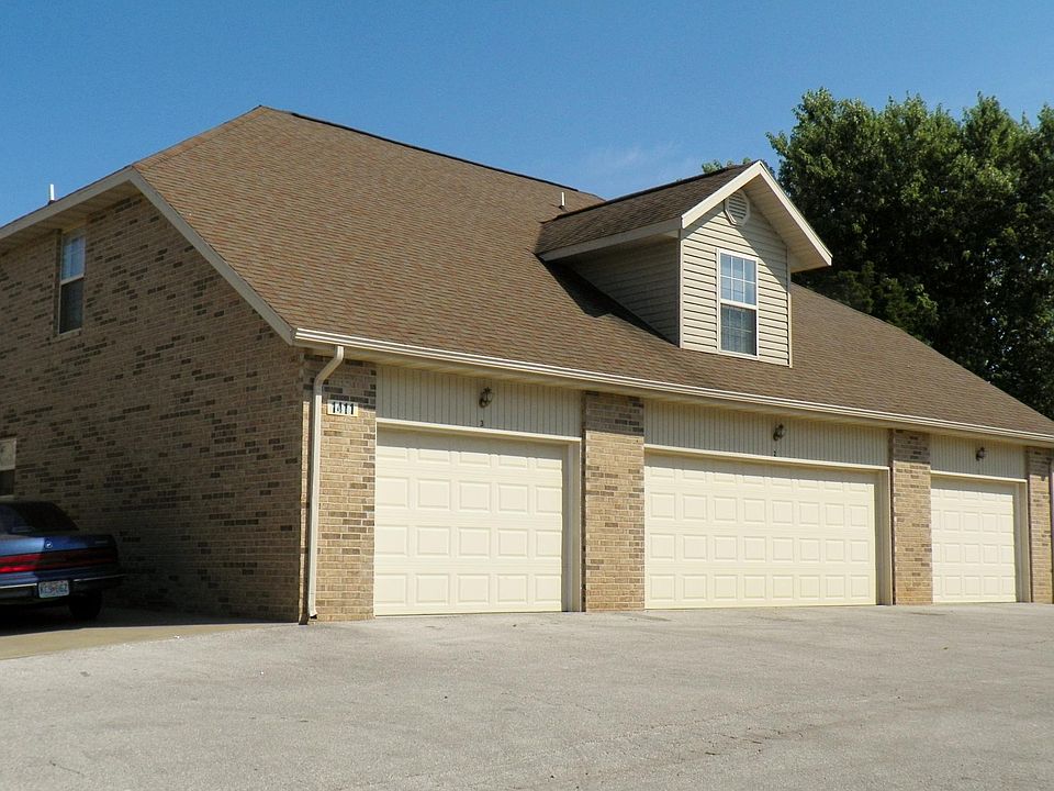 One car garage and an assigned parking space by the building