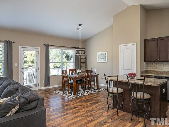Laminate Flooring throughout main living space - Breakfast and Kitchen Area