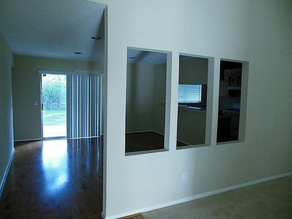 Viewing from the Den and entry toward the Dining area and Kitchen