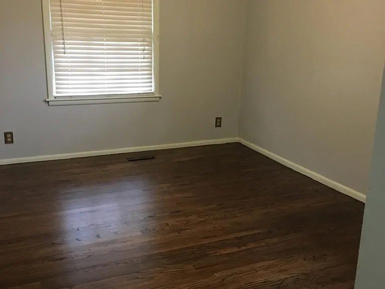 All three bedrooms are painted in a light gray, have have ceiling fans, wood blinds, and nice size closets.