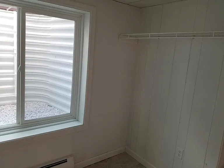 Walk in closet downstairs with window Egress