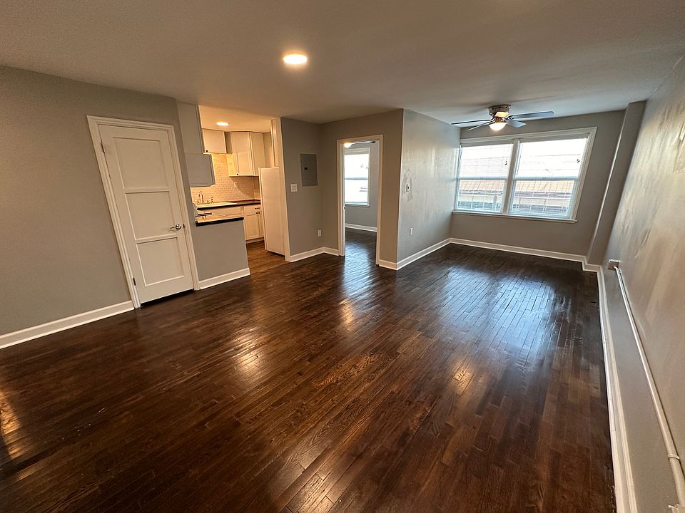 Living room - original oak hardwood floors, new paint, baseboards, and lighting.