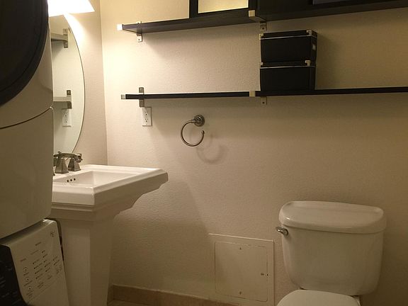 Downstairs half-bath & stacked front-load laundry