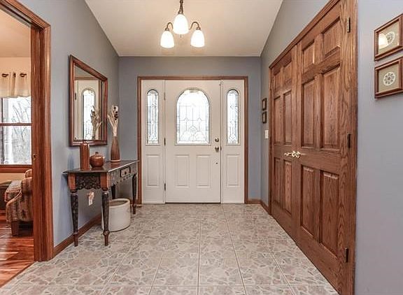 Enter in thru the foyer with office space to the right and a large coat closet on your left.
