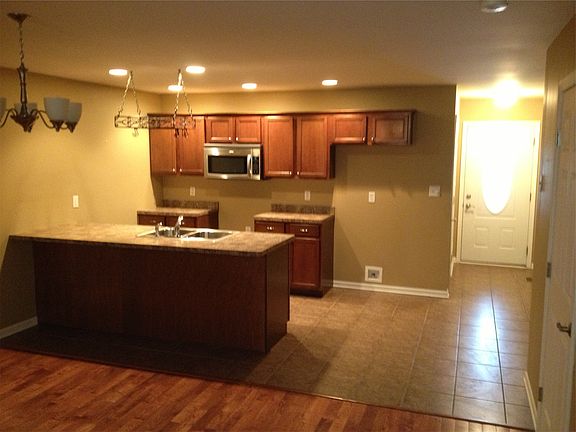 Kitchen overlooks living/dining area