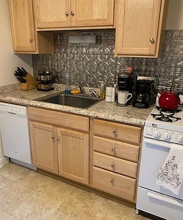 Dishwasher and range wall