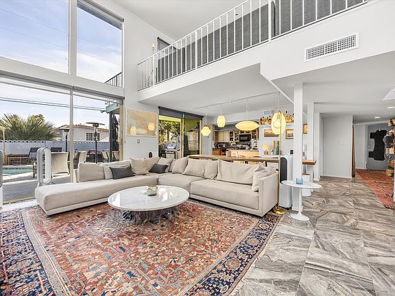 Living room with view of upstairs mezzanine