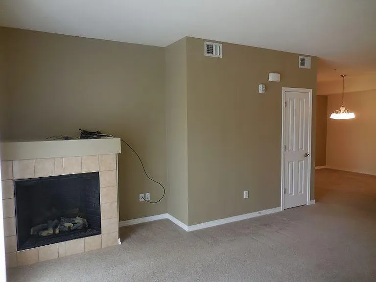 Living room with electric remote controlled fireplace.