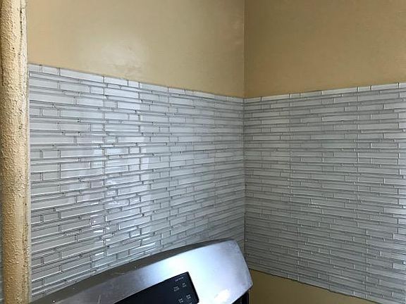 Kitchen, with glass tile backsplash.