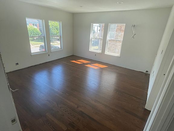 Restored original hardwood flooring throughout. It has since been covered up to protect from damage.
