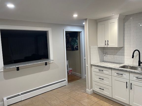 Dine in kitchen with counter space into the living room!