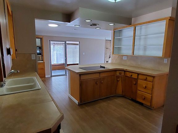 View of the kitchen entering from the back door.