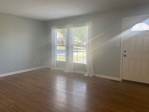 Living Room - Beautiful hardwood flooring throughout the main living areas