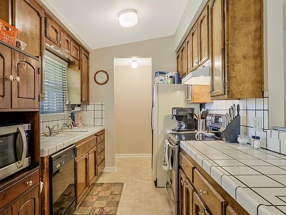 Kitchen with tile counters.