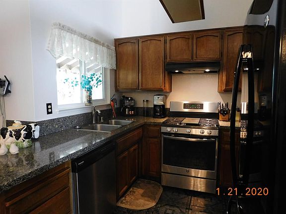 Newly upgraded kitchen with granite counters, new sink and faucet.  Newer appliances.