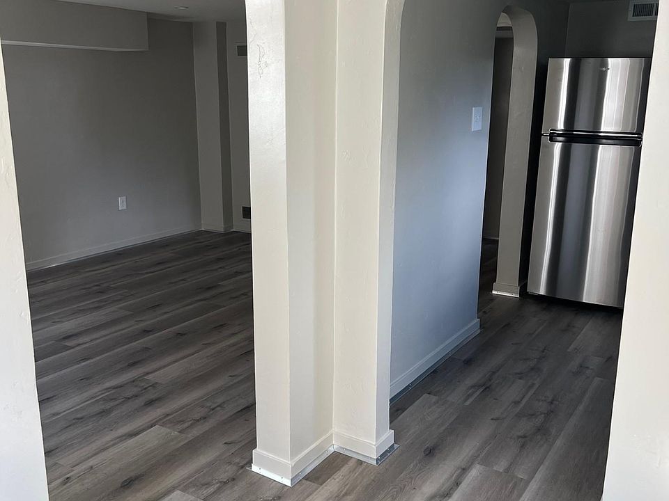 View from entry foyer into living room and kitchen