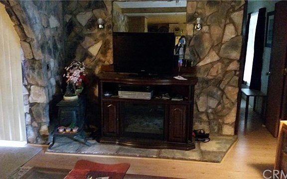 Flagstone fire hearth with wood burning stove