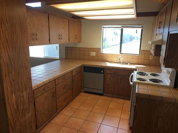 Kitchen with electric range/oven, dishwasher, garbage dispos