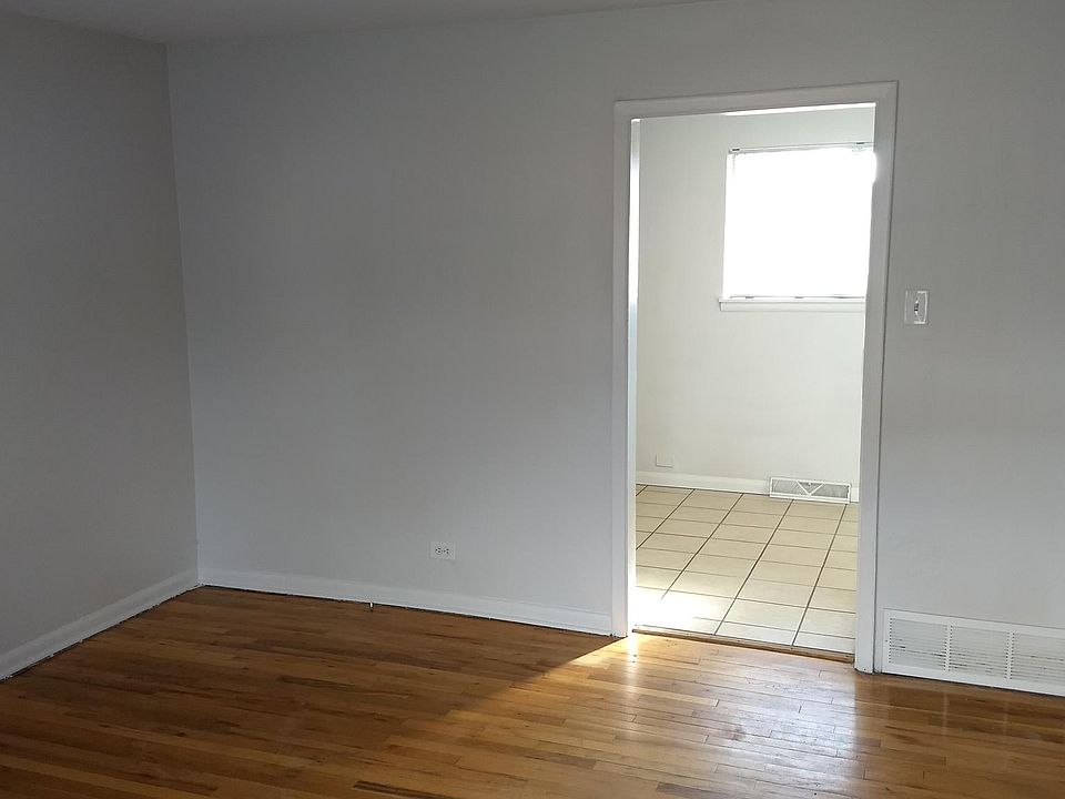 Sunny view from the living room into the kitchen.