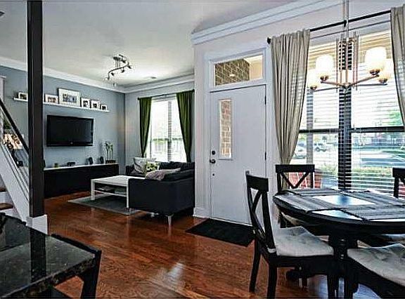 First floor is open floor plan design with living room, dining, kitchen, and half bath.