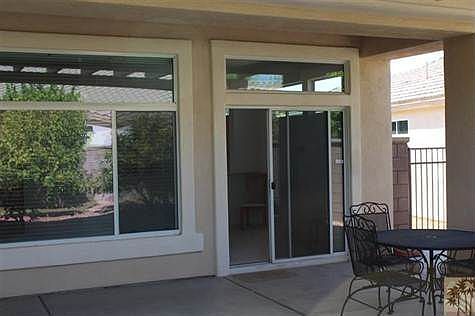 From the Back you can see the Transom Windows Only Available with 10 Foot or Higher Ceilings. This Premiere Series Home offers this Desirable Feature AND there are Two Eight Foot Tall Doors Which Open to the Master Bedroom. Lots of Architectural Angles in this Home Brought in an Award in Design when the Model Was Introduced to the Development.