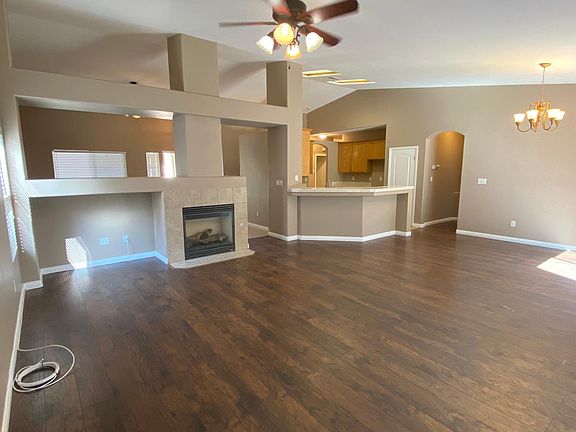 Great room with fireplace open to the kitchen