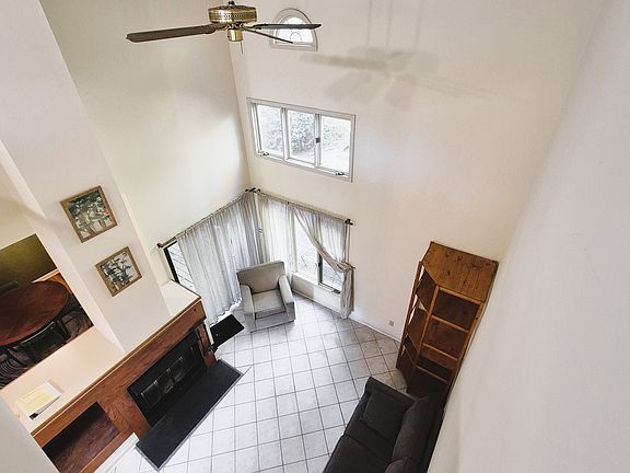 view of living room from upstairs lofted walkway