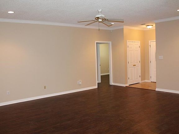 Inviting Family Room with lovely wood-like vinyl floors.