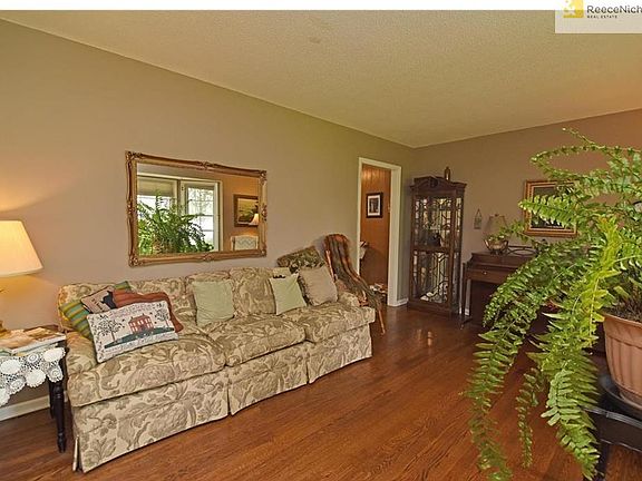 Gorgeous, refinished hardwoods extend from living room thru family room thru all three bedrooms