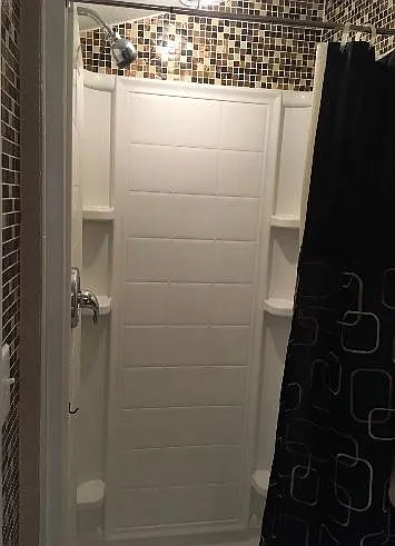 Small walk in shower in main bedroom