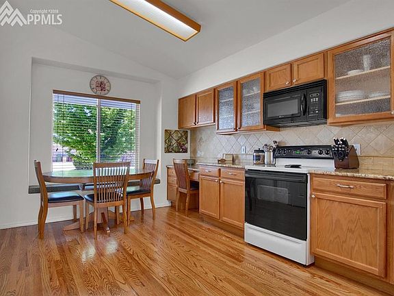 Gleaming hardwoods and lots of storage in this kitchen