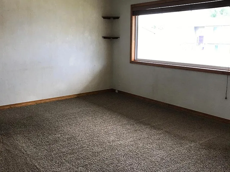 Front room looking toward window that faces the street