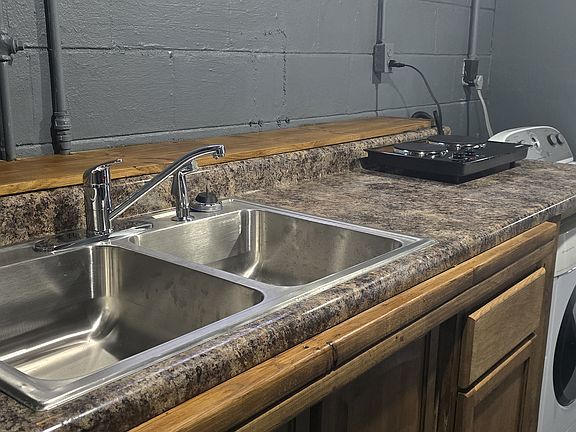 New sink, cabinets & faucet.