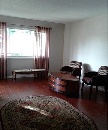Attractive warm flooring. Newer windows.