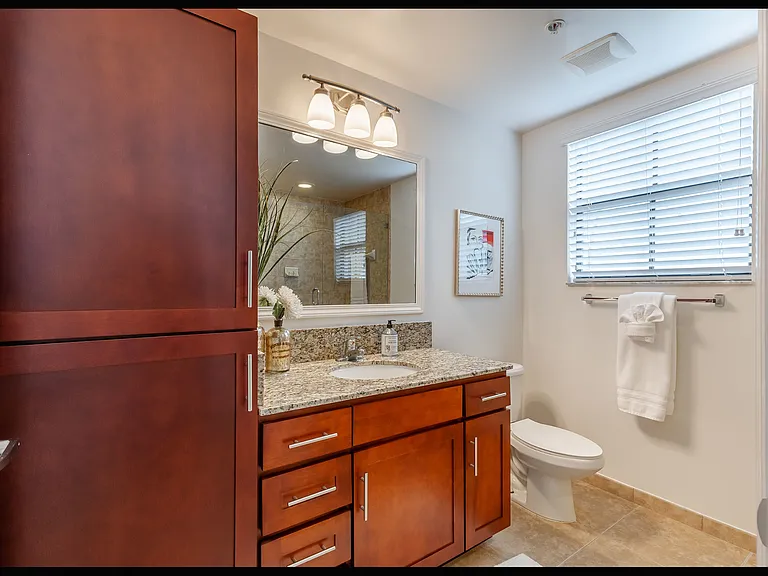 Porcelain tile floors in living areas, kitchens and bathrooms