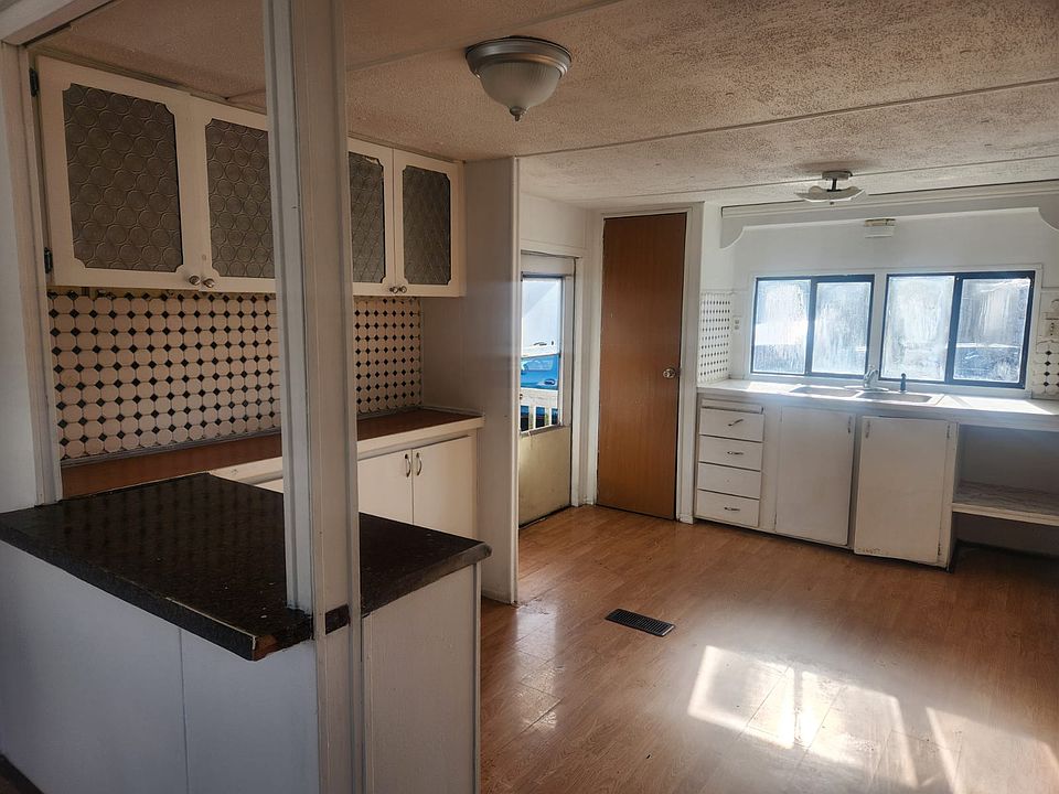 A refrigerator will be provided. Plenty of storage and countertops in this sunny kitchen.
