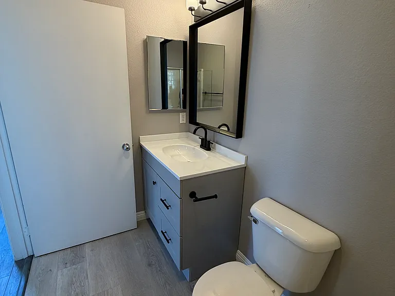 Stylishly renovated primary bathroom.