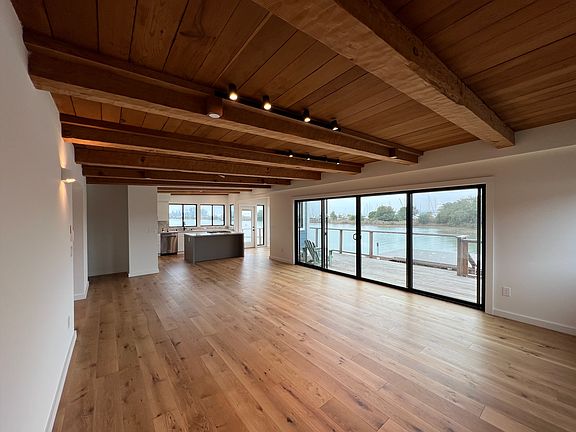 Living room facing kitchen & outdoors