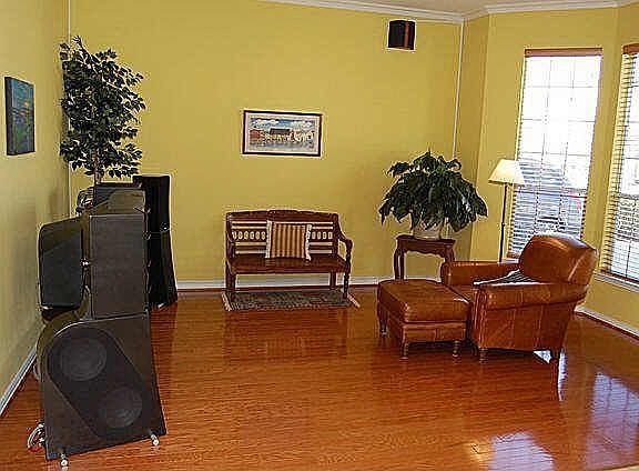 Formal parlor with hardwoods.