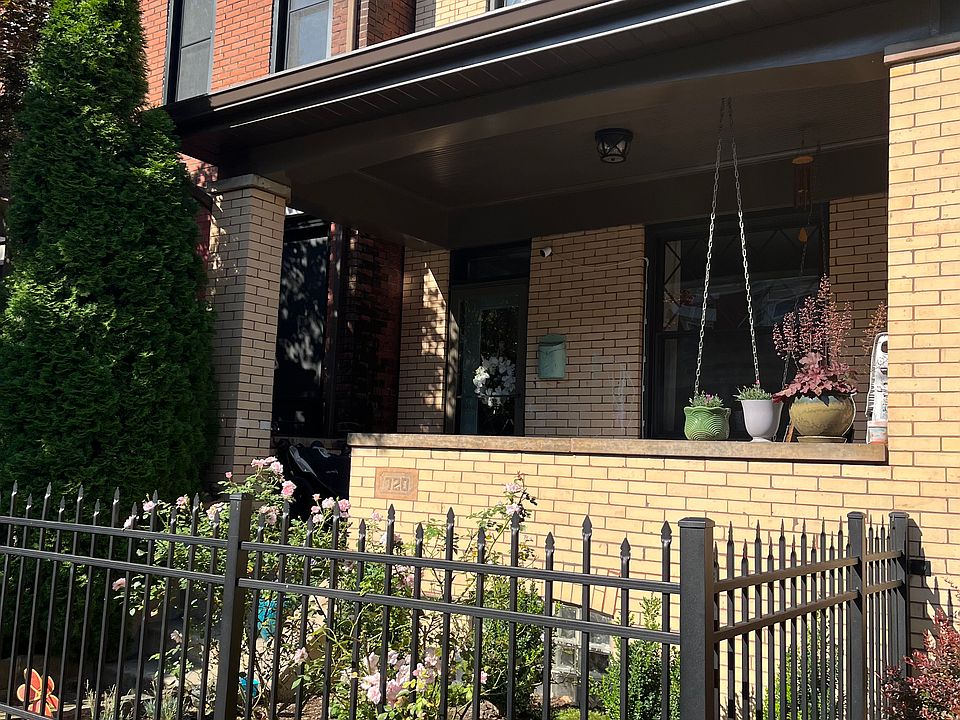 Front of the house with gated entrance.