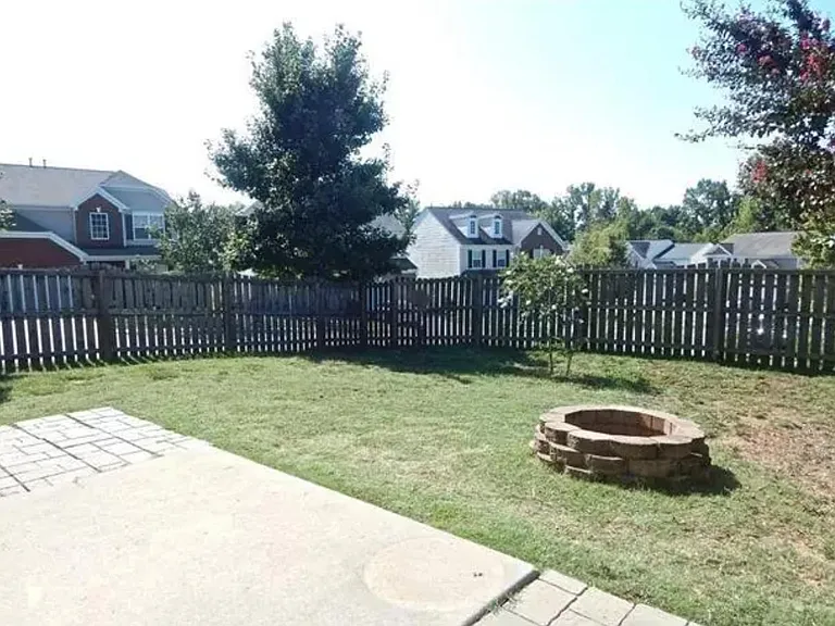 Fenced Backyard with patio and fire pit