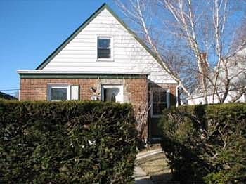 front of house with natural fence