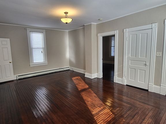 Livingroom, door to primary bedroom and front closet
