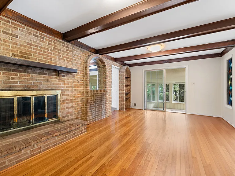 Family room off kitchen with wood-burning fireplace